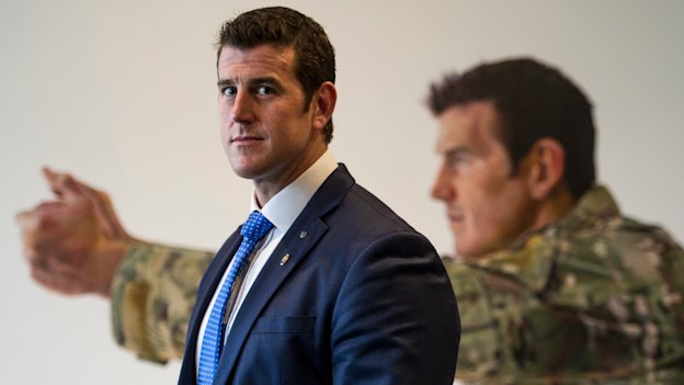 Ben Roberts-Smith in front of his portrait at the Australian War Memorial in Canberra.