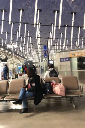 Ellie Chen waits for a flight to Sydney from Wuhan.