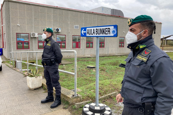 Police officers guard during the first hearing of the ‘Ndrangheta crime syndicate trial near the Calabrian town of Lamezia Terme, southern Italy.