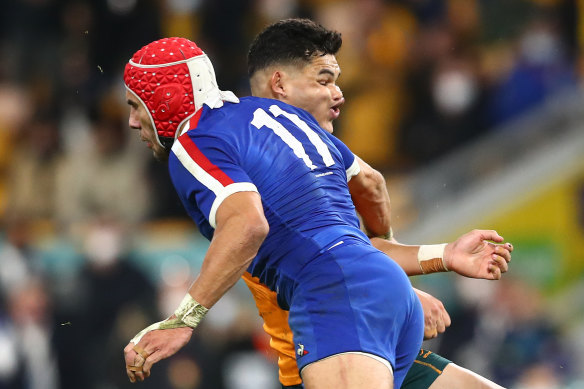 Noah Lolesio is tackled by Gabin Villier in the first Test at Suncorp Stadium. 