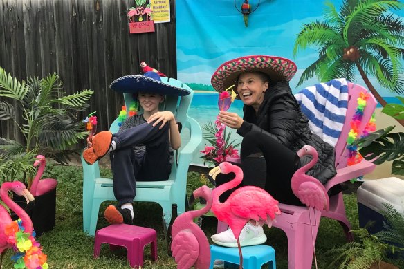 People pose in the virtual holiday photo booth. 