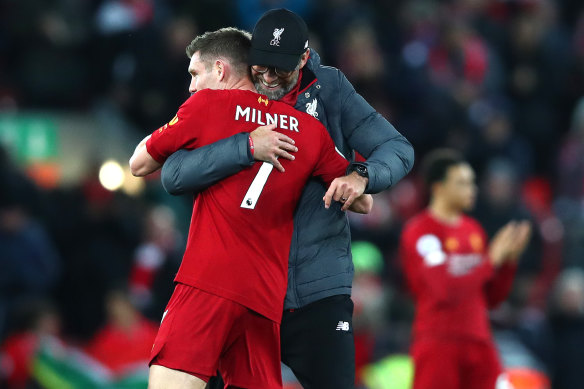 Liverpool manager Jurgen Klopp embraces James Milner after thumping Everton.
