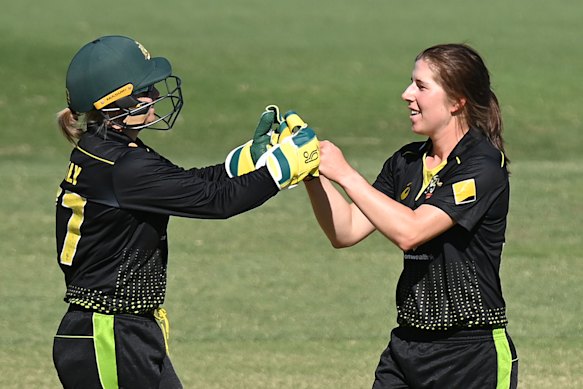 Healy and Georgia Wareham celebrate the wicket of Lauren Down.
