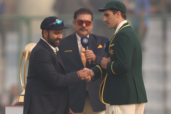 Pat Cummins at the coin toss in Delhi. He had been given the option of flying home before the match.