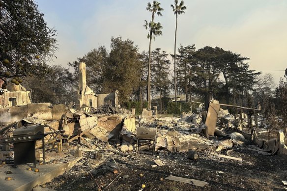 A barbecue is among the remnants of the burnt home of Anna Yeager and her husband Darin Bresnitz in Altadena.