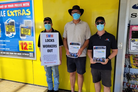 WA Newspapers printing staff Dale, Jim and Gabriel protesting the company outside one of its major advertisers JB HiFI.