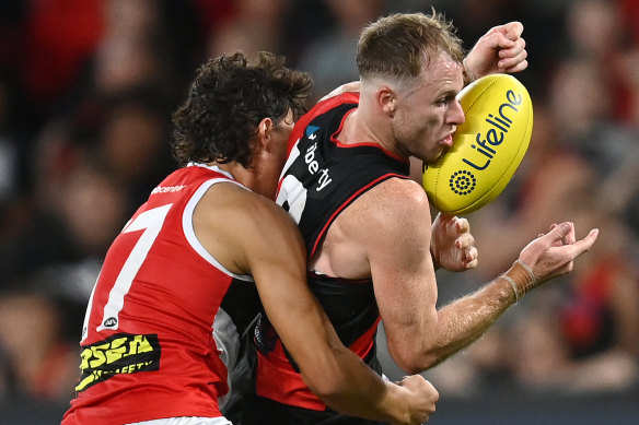 Nick Hind, right, pictured in action during an AAMI Community Series match on Saturday, is ready to bounce back after missing the Bombers’ elimination final in Tasmania last year. 