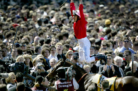 Frankie Dettori performs his trademark star jump dismount after winning on Spinning Hill at Moonee Valley two decades ago.