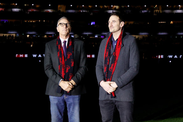 Jobe Watson (right) was the only millennial Bomber celebrated, introduced alongside his three-time premiership-winning dad, Tim.