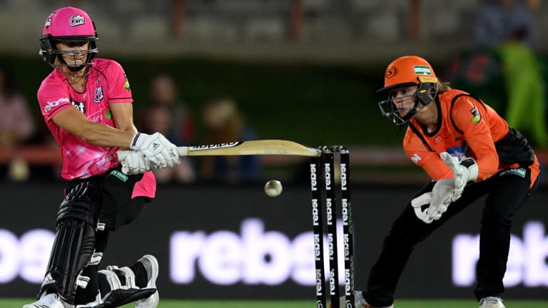 Too strong: Perry takes on the Thunder attack at North Sydney Oval.