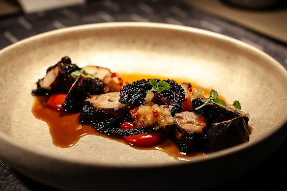 Grilled octopus with harissa and pineapple salsa.
