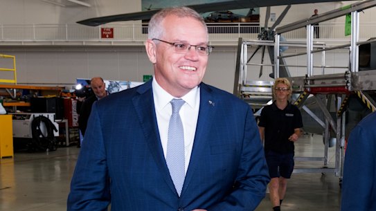 Election campaign. Australian Prime Minister Scott Morrison visits Sikorsky Australia’s purpose built Logistics facility in Nowra, in the seat of Gilmore. The Federal election will be held on Saturday 21st May 2022.. Photographed Sunday 8th May 2022. Photograph by James Brickwood. SMH 220508. Ausvotes22. The PM looks at a MH-60R Navy Seahawk Helicopter. With Andrew Constance - Liberal candidate for Gilmore. 