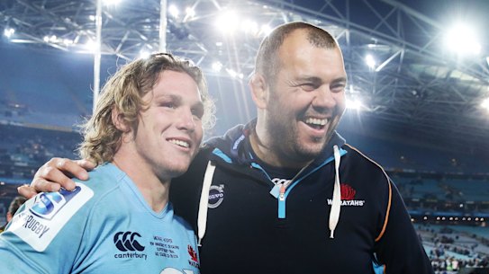 Michael Cheika and Michael Hooper celebrate victory over the Crusaders in the Super Rugby decider in 2014. Is Cheika the man to turn around the waratahs?