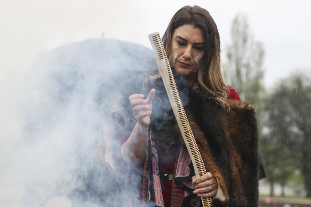 Senator Lidia Thorpe during a smoking ceremony to welcome her to Ngunnawal and Ngambri Country by the Traditional Custodians of the land, at the Aboriginal tent embassy in front of Old Parliament House in Canberra.