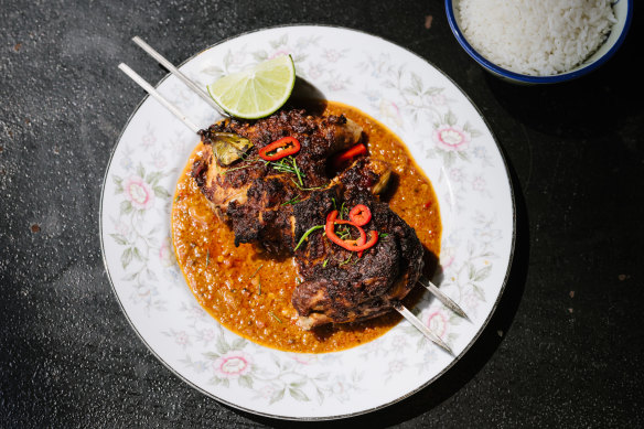Grilled half chicken marinated in Lombok red chilli paste.