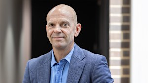 Neal Reed, chief executive at Procter & Gamble Australia and New Zealand, leans against a railing at the company’s Sydney head office.