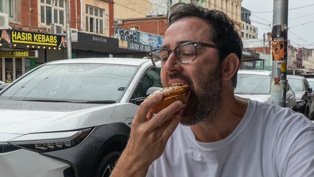 Andy Allen tucks into a Falco pie