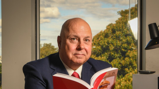 Victorian Treasurer Tim Pallas with last year’s state budget.