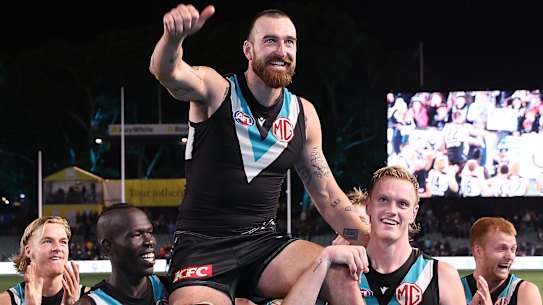 Thumbs up: Port salutes for Charlie Dixon in his 200the match.