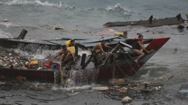 A boat carrying asylum seekers sinks off the coast of Christmas Island in 2010. 