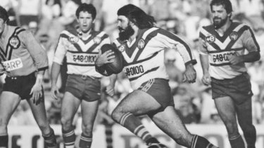 Bulldogs cult hero Geoff Robinson charges at the Balmain defence in the 1980s.