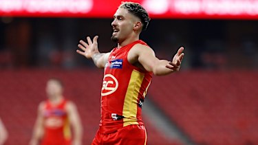 Bound for glory: Gold Coast's Izak Rankine on debut against the Demons.