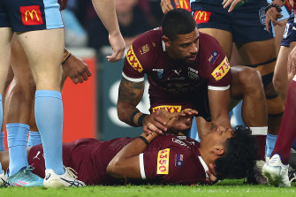 Queensland's Selwyn Cobbo of the Maroons is mentored by Dane Gagai of the Maroons at the start of the third game.