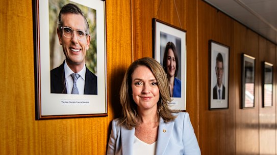Kellie Sloane and the Liberal wall of fame at NSW Parliament House.