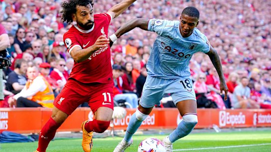 Liverpool’s Mohamed Salah, left and Aston Villa’s Ashley Young battle for the ball.