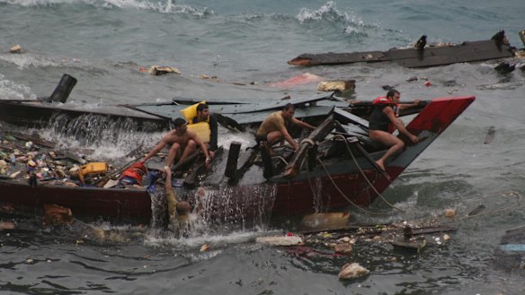 Tragedy ... a boat carrying asylum seekers sinks off Christmas Island in 2010. 