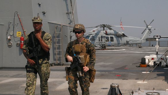 US marines patrol the USS Blue Ridge as it anchors off Manila, Philippines. America has vowed to "sail, fly and operate wherever the law allows us to" amid China's objections in the South China Sea.