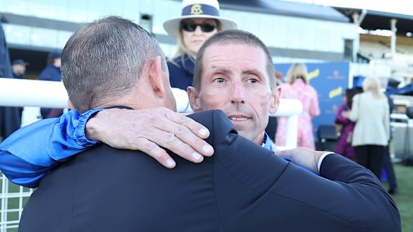 Chris Waller embraces Nash Rawiller.