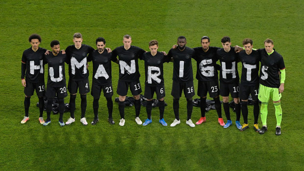 The German soccer team stage a protest at the start of their World Cup qualifier against Iceland in March.