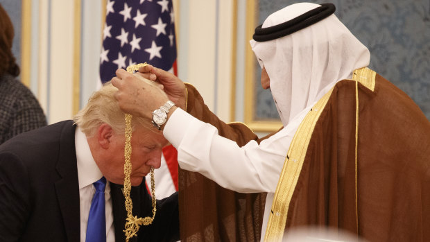 Saudi King Salman presents President Donald Trump with The Collar of Abdulaziz al-Saud Medal at the Royal Court Palace last year.