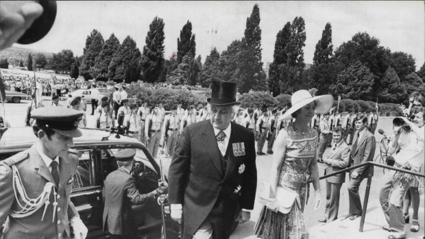 Protestors outside Parliament House as Sir John and Lady Kerr arrive