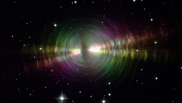 The Egg Nebula is a rapidly evolving pre-planetary nebula spanning about one light year toward the constellation of Cygnus. Thick dust blocks the centre star from view, while the dust shells further out reflect light from this star.