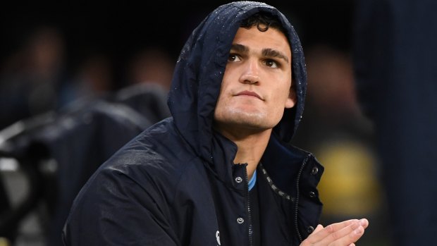 Sidelined: Nathan Cleary watches from the Blues bench after being forced off the field.