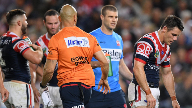 Soldiering on: Cooper Cronk appears exhausted after playing half the match with a hurt shoulder.