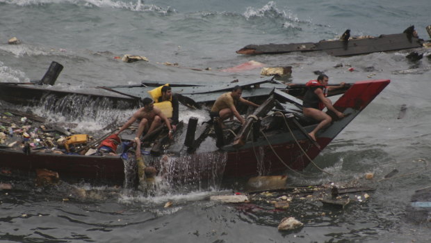 Tragedy ... a boat carrying asylum seekers sinks off Christmas Island in 2010. 