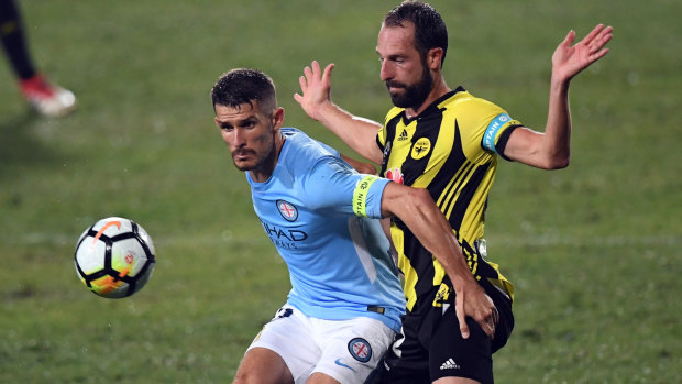City's Dario Vidsic is challenged by Andrew Durante of the Phoenix.