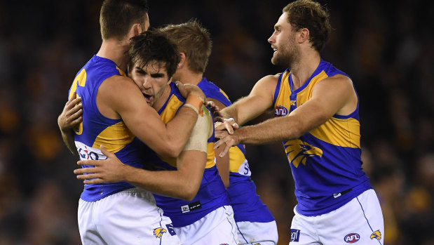 Andrew Gaff of the Eagles (second from left) celebrates after kicking a goal. 