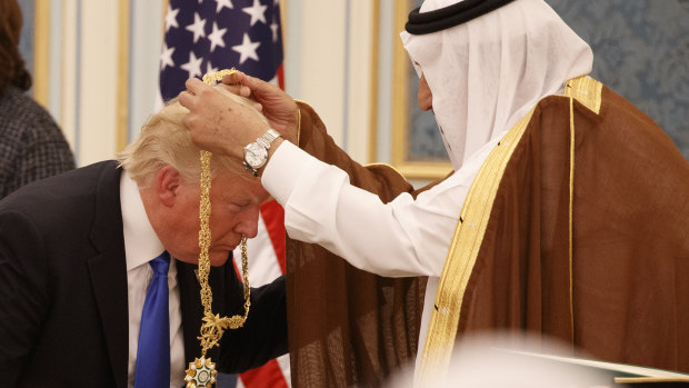 Saudi King Salman presents Donald Trump with The Collar of Abdulaziz al-Saud Medal at the Royal Court Palace last year.