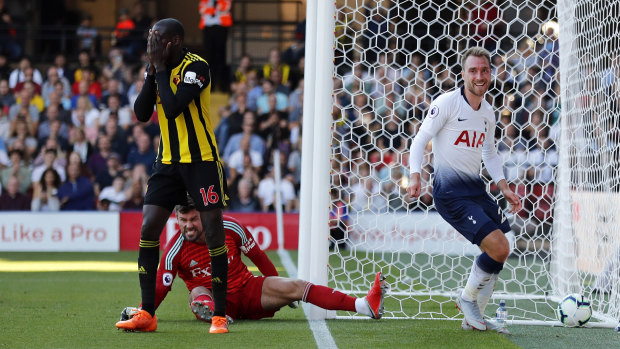Watford's Abdoulaye Doucoure scores an own goal to opening the scoring for Tottenham Hotspur at Vicarage Road on Sunday.