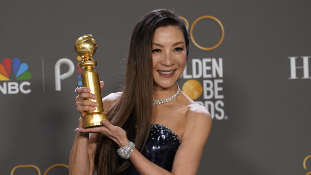 Michelle Yeoh with her award for best performance by an actress in a motion picture, musical or comedy, for Everything Everywhere All at Once.