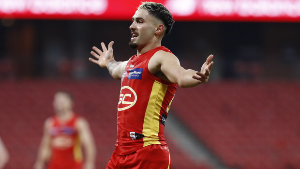 Bound for glory: Gold Coast's Izak Rankine on debut against the Demons.