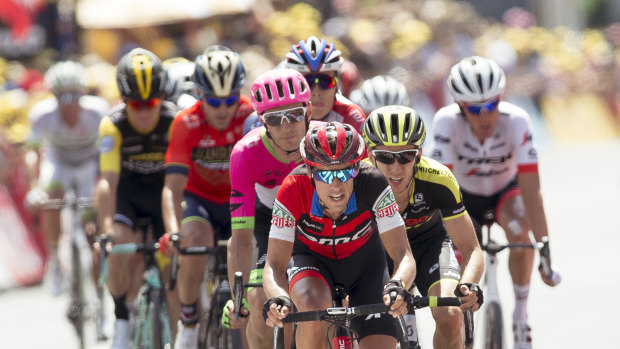 Not happy: Richie Porte leads his group over the finish line after a crash split the peleton.