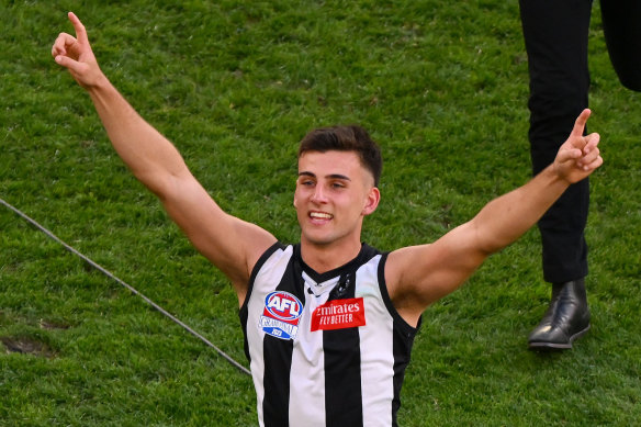 Nick Daicos of the Magpies celebrates victory.