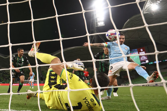 Jamie Maclaren scores a goal during round 25. 