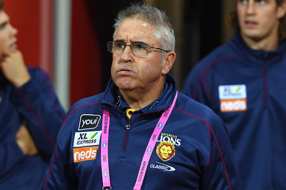 Lions coach Chris Fagan walks onto the field during the round 2 clash with Geelong on Friday night. 