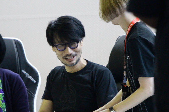 Hideo Kojima meeting fans during an autograph session.